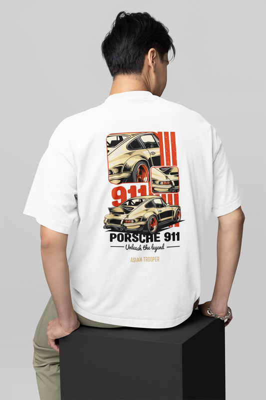 Person wearing a white t-shirt with Porsche 911 graphic on the back, standing on a gray background